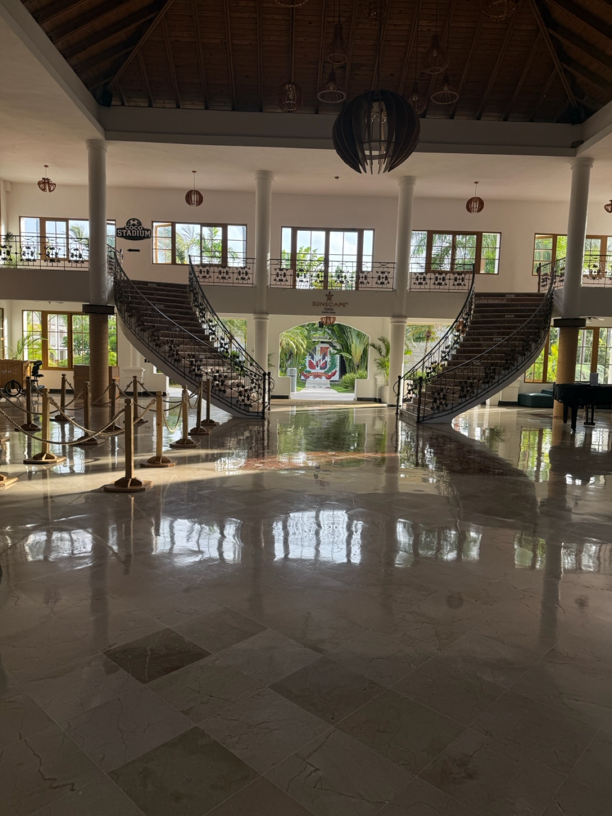 Resort lobby with a grand double staircase in the Dominican Republic